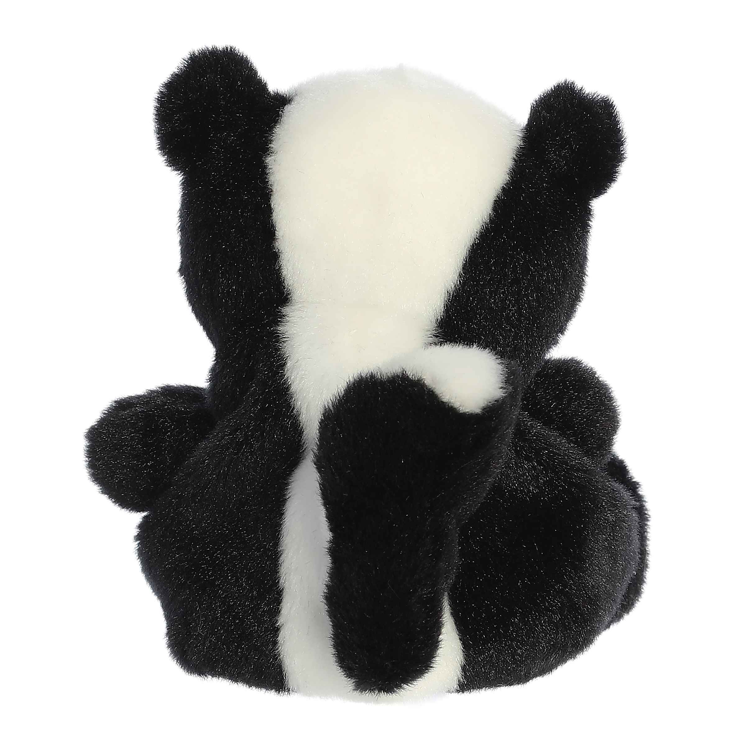 Plush toy skunk on a white background