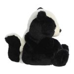 Plush skunk toy on a white background