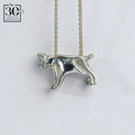 Silver bobcat-shaped pendant on a chain against a white background