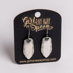 Silver earrings on a 'Girl Run Away with the Spoon' branded card.