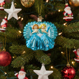 Decorative ornament with two women in blue dresses labeled 'SISTERS' on a white background