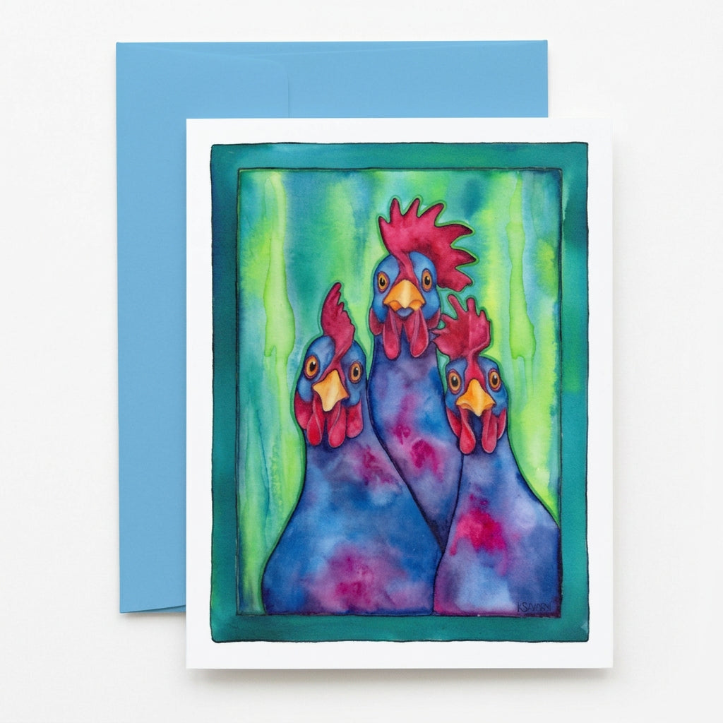 A square art print or greeting card featuring a colorful watercolor-style illustration of three chickens, placed on top of a blue envelope against a white surface.