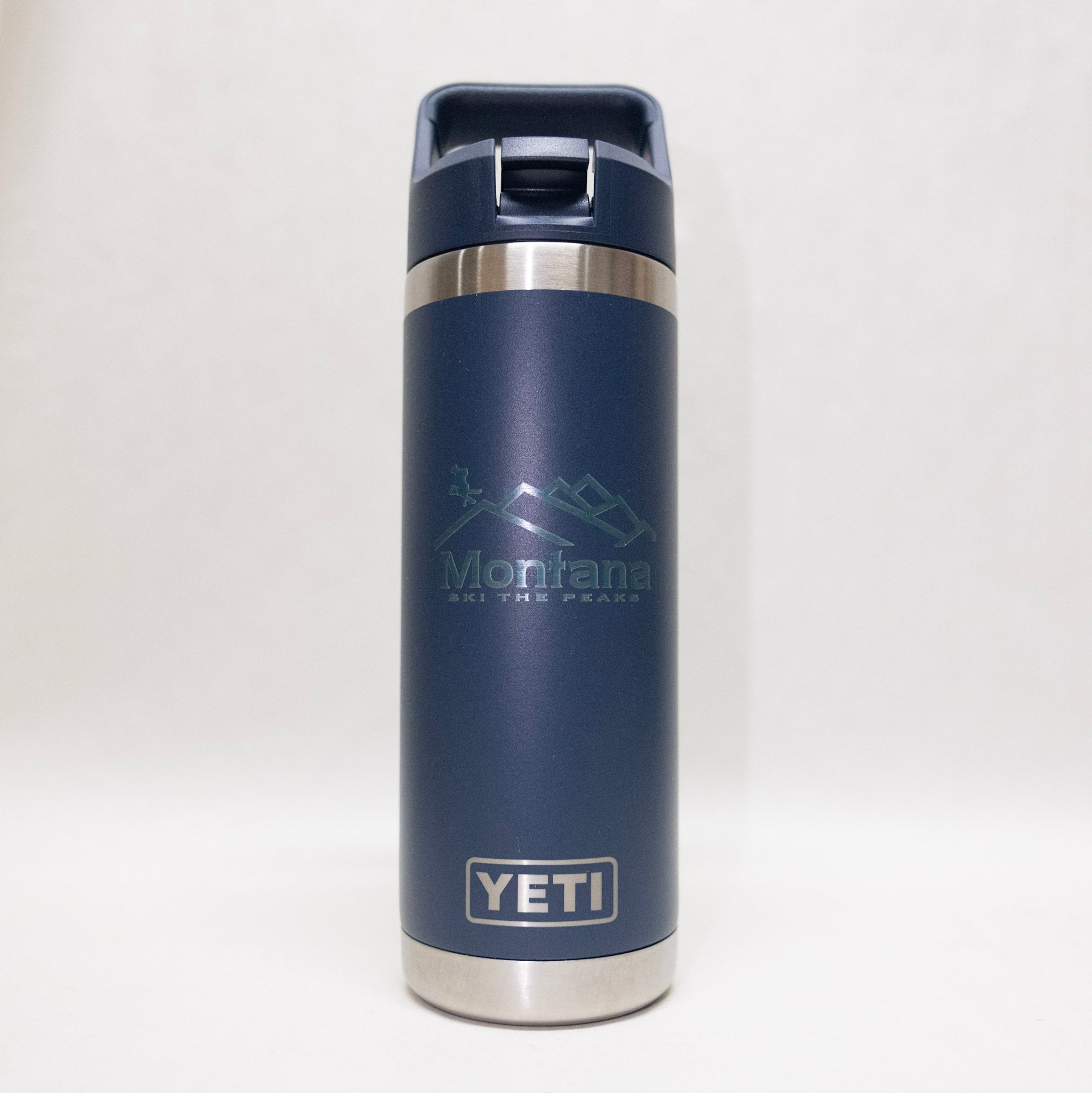 Blue YETI mug with Montana logo on a white background