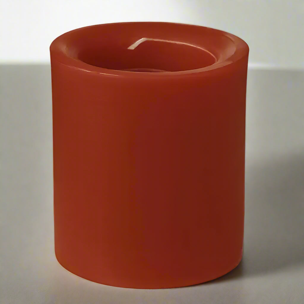 Red candle on a white background