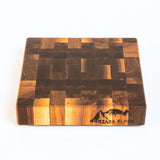 Wooden cutting board with a checkered pattern and 'Montana Block' branding on a white background