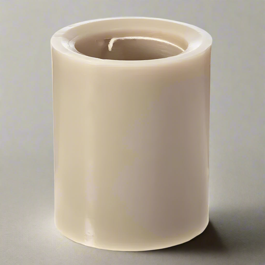 Beige cylindrical candle on a white background