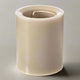 Beige cylindrical candle on a white background