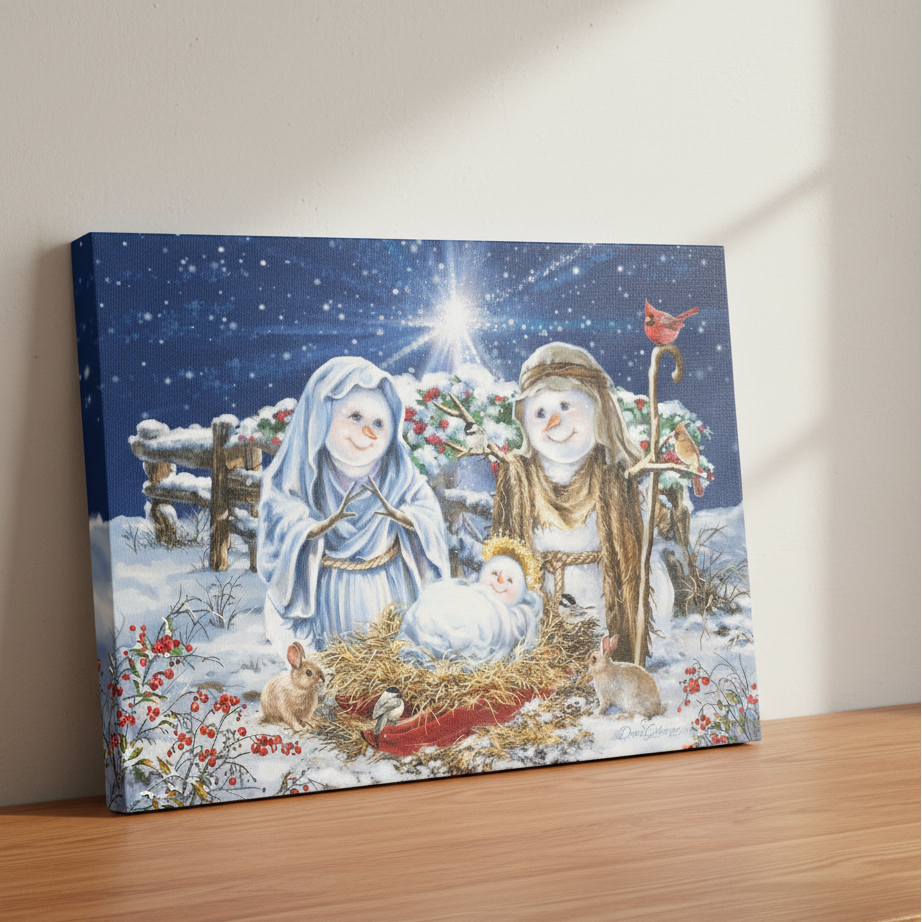 Canvas print of a snowy nativity scene with Mary, Joseph, and baby Jesus on a wooden surface.