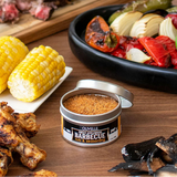 Olivelle Sweet Applewood Barbecue rub with grilled vegetables, corn, and meats on a wooden surface.