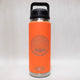 Orange YETI water bottle with a black lid on a white background