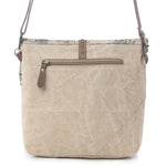 A beige canvas crossbody bag with brown leather accents, a front zippered pocket, and a floral patterned top trim, shown against a plain white background.
