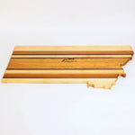 Wooden cutting board shaped like the state of Tennessee on a white background