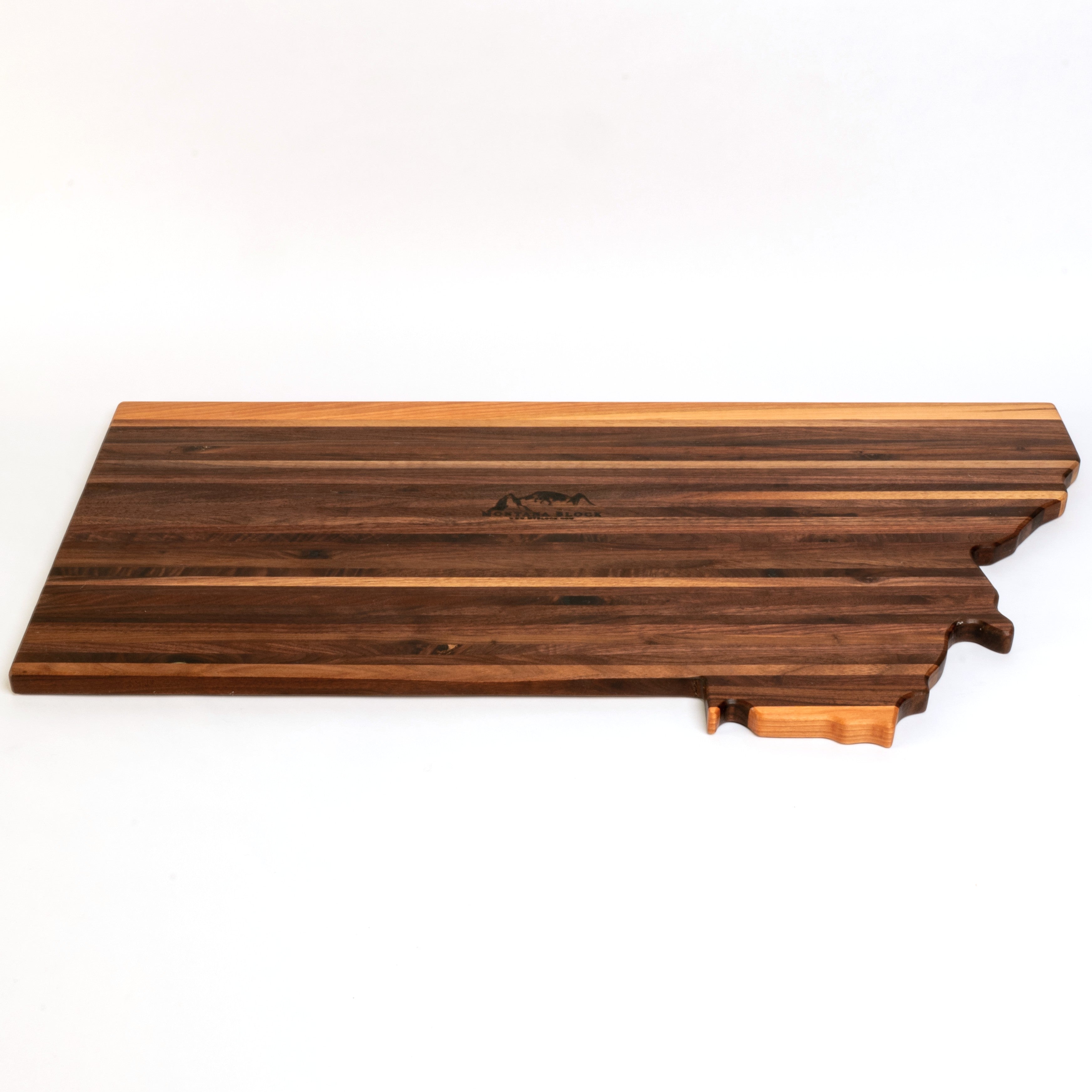 Wooden cutting board shaped like the state of Tennessee on a white background
