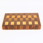 Wooden cutting board with a checkered pattern on a white background