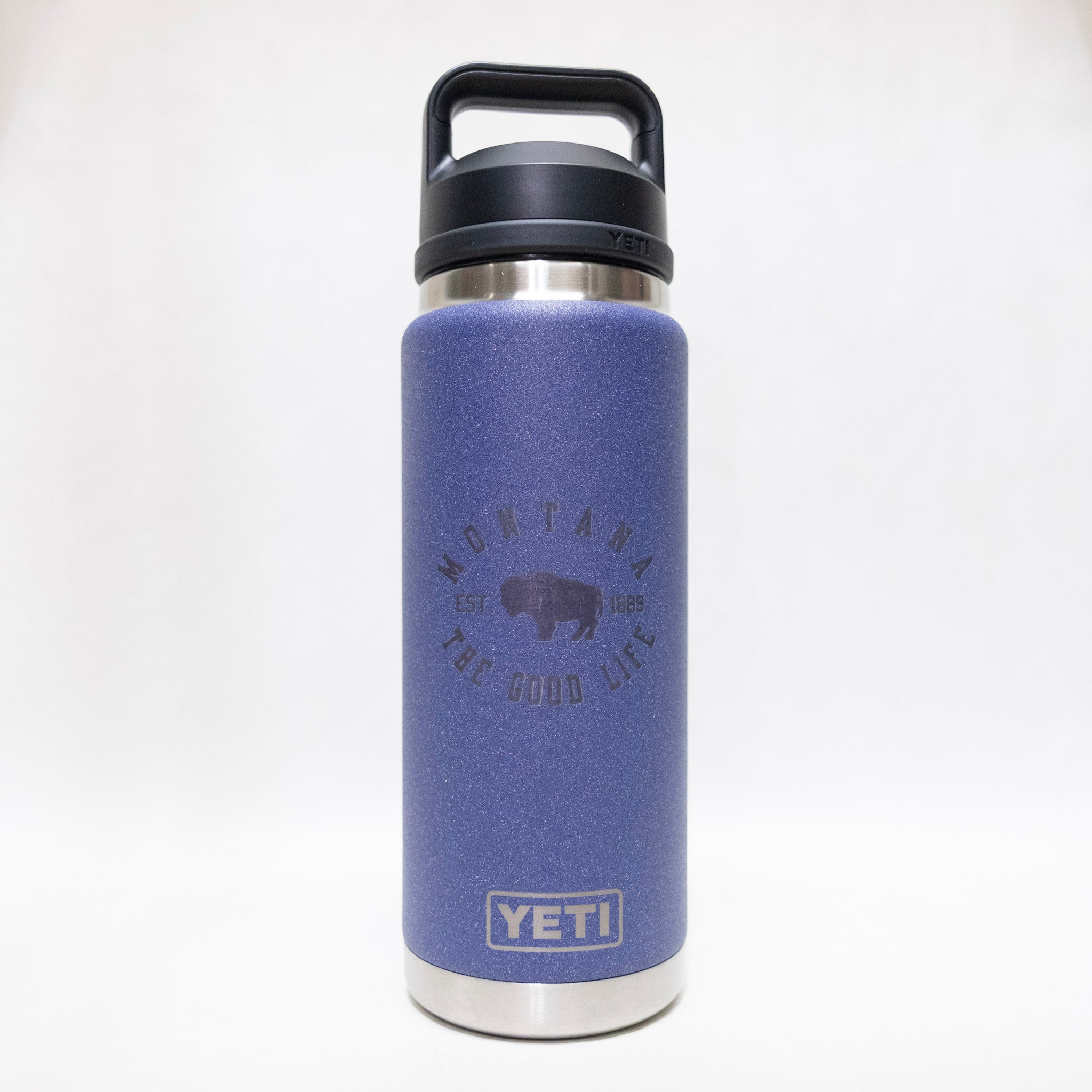 Blue YETI water bottle with black lid on a white background