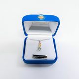 Jewelry box with a necklace featuring a Montana Sapphire pendant on a white background