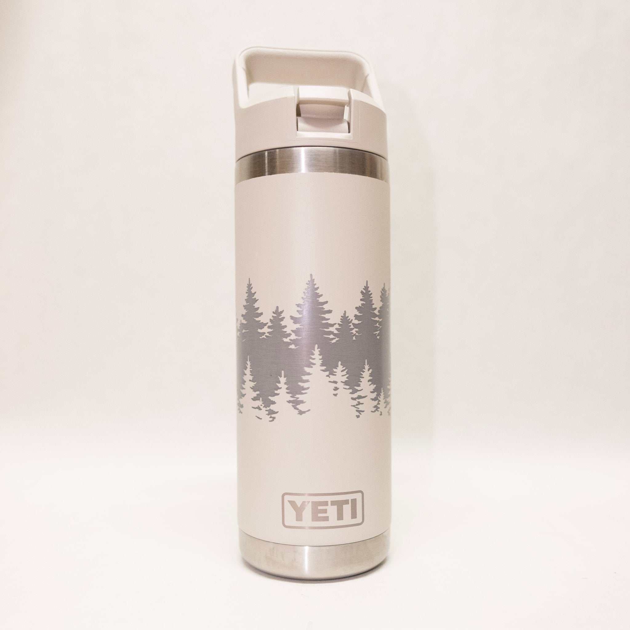 White YETI bottle with tree design on a white background