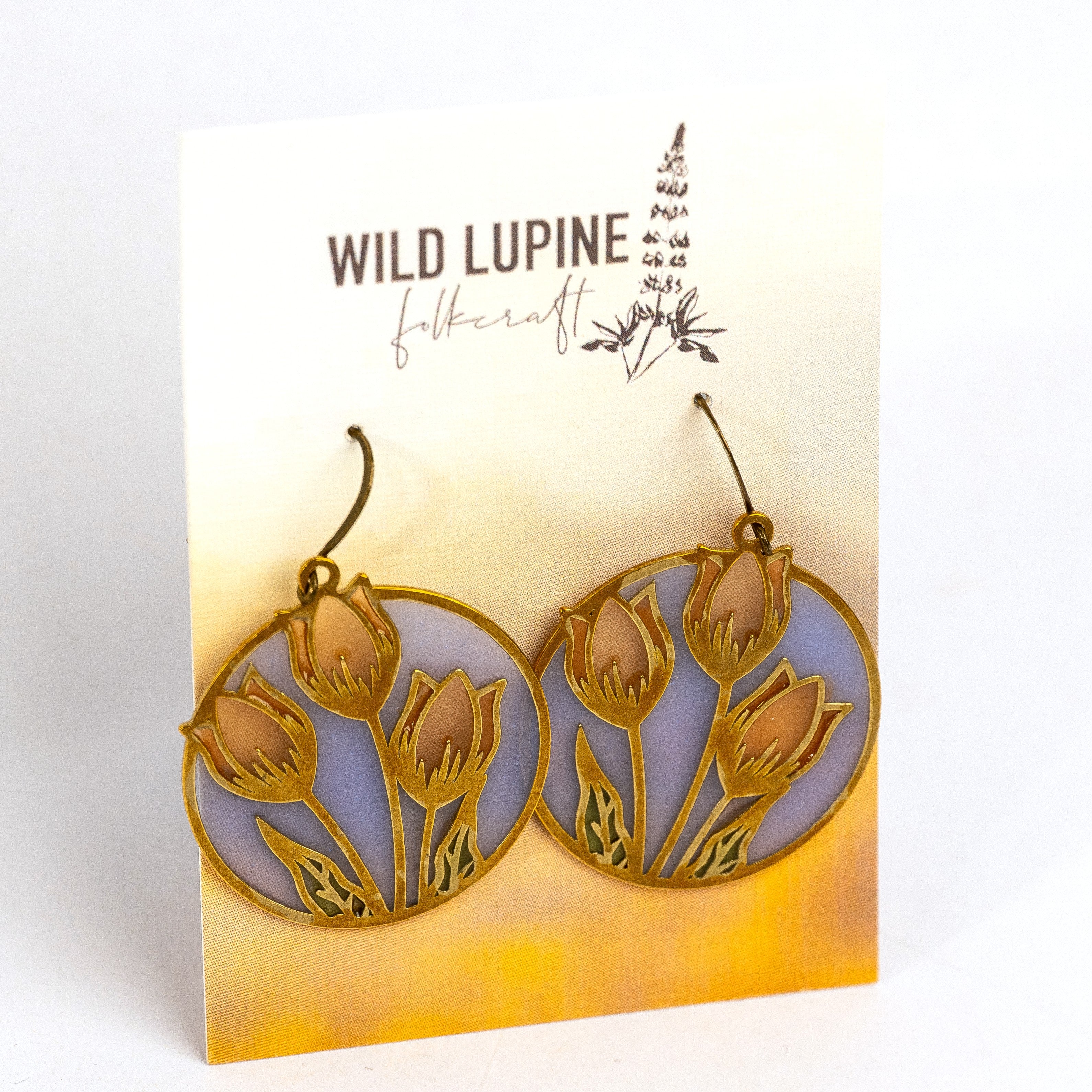 Earrings with floral design on a Wild Lupine Folkcraft card