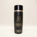 Black YETI mug with bear graphic and text on a white background