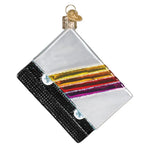 Decorative glass ornament with colorful stripes on a white background