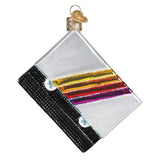 Decorative glass ornament with colorful stripes on a white background