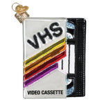 VHS video cassette ornament with colorful design on a white background