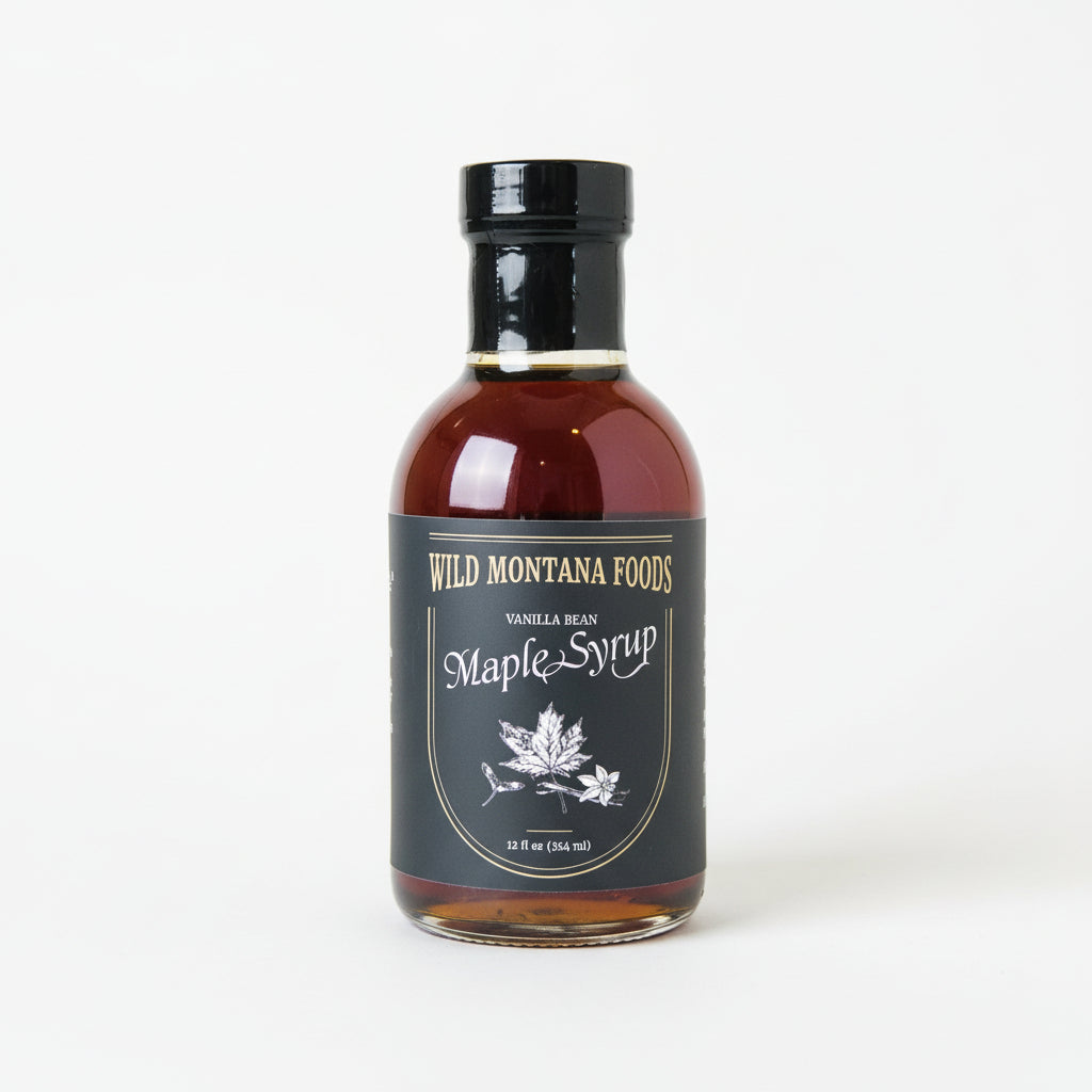 Bottle of Wild Montana Foods Maple Syrup on a white surface
