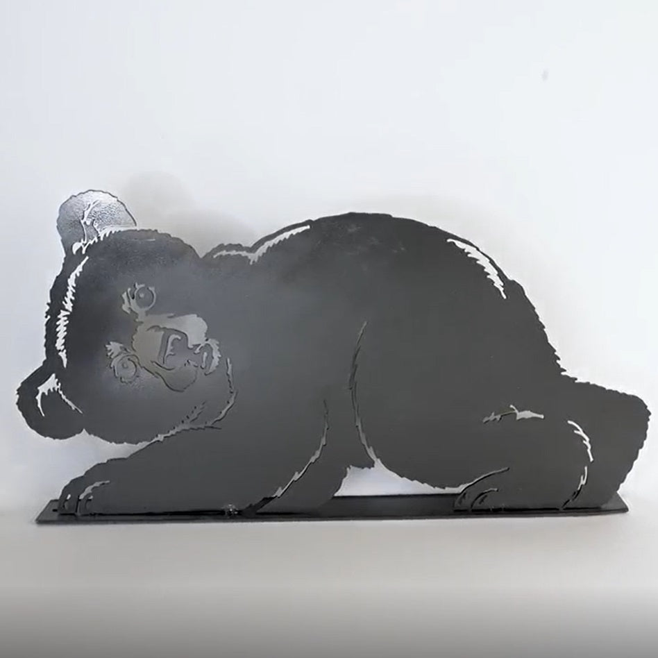 Metal bear sculpture on a white background