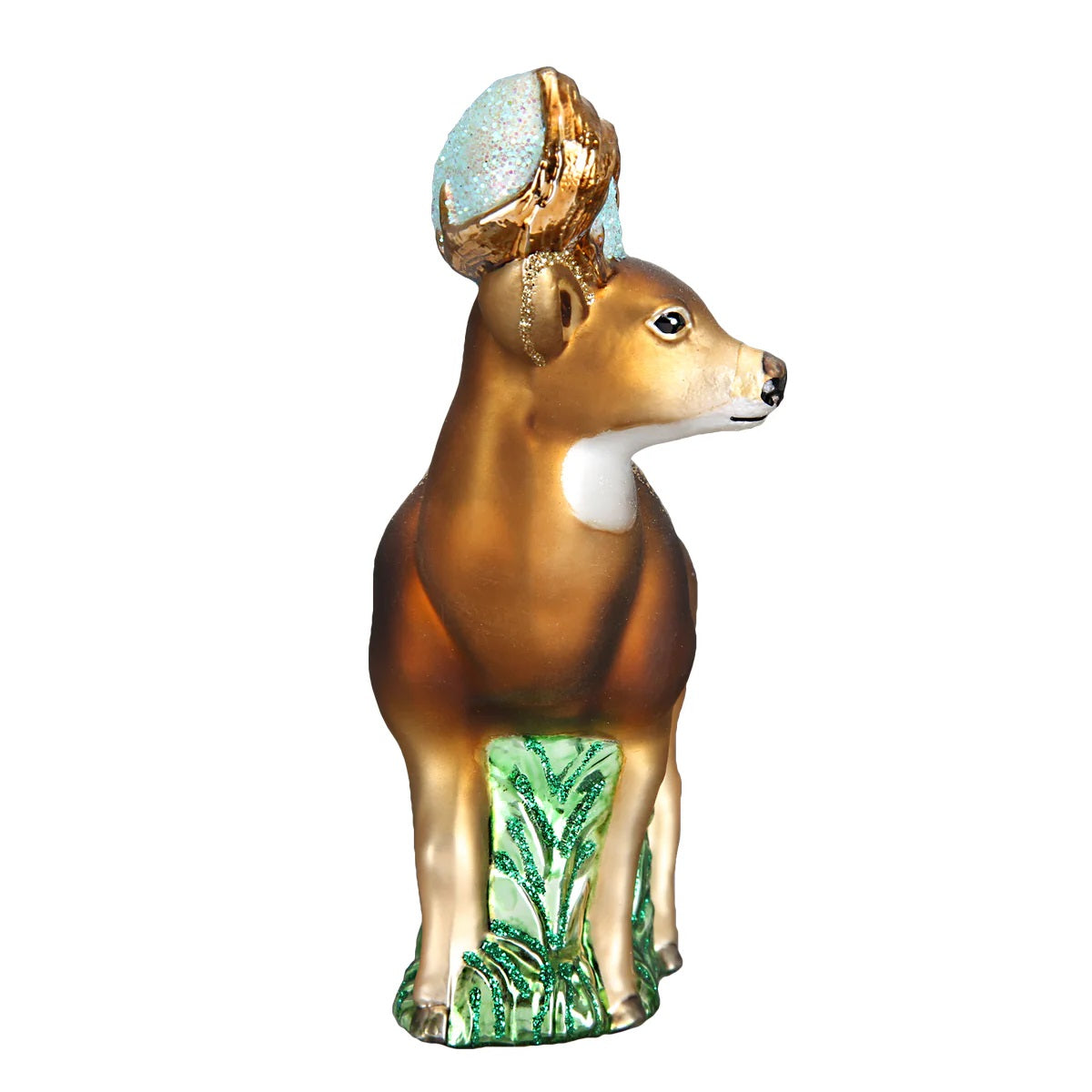 Decorative deer ornament with gold antlers and green base on a white background