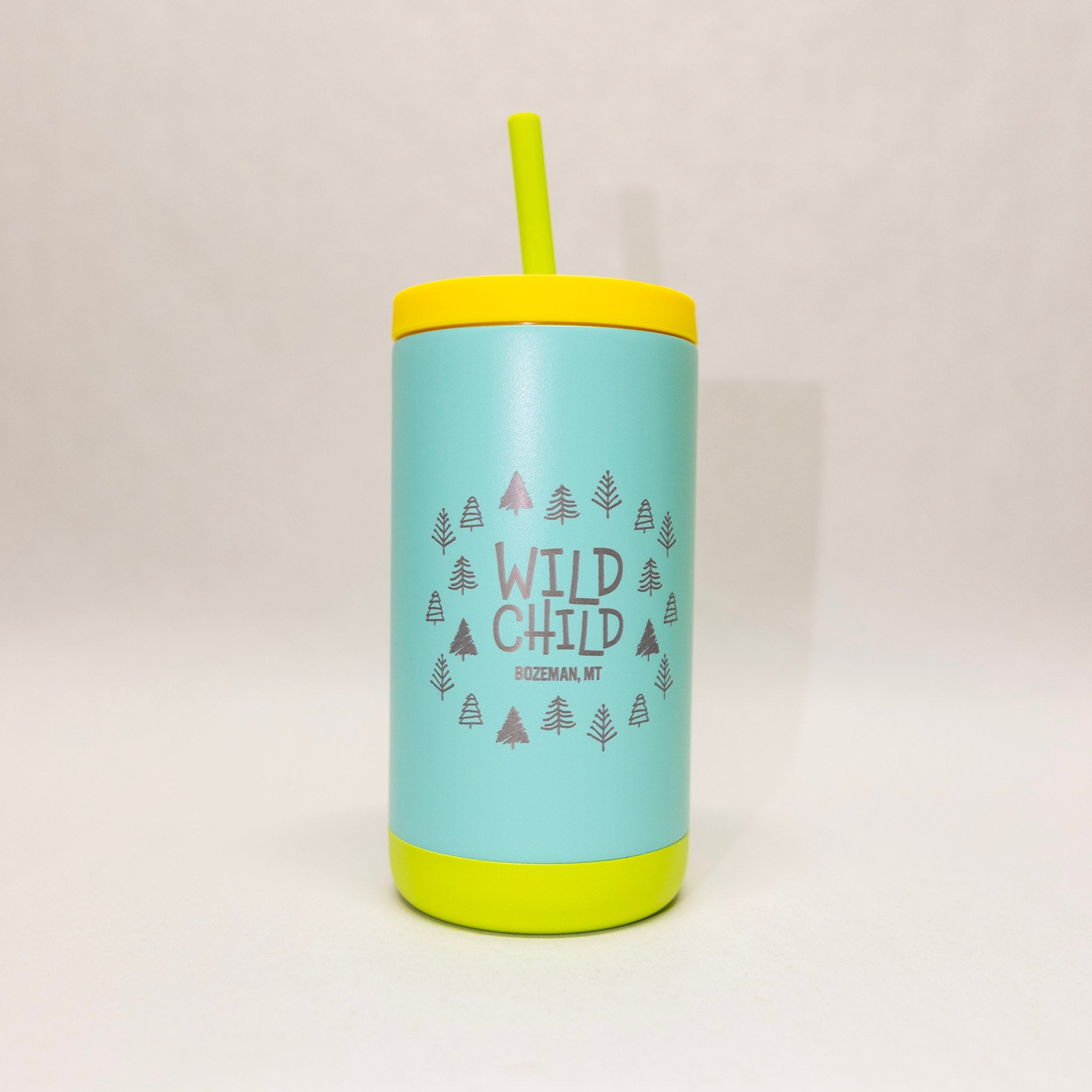 Light blue tumbler with yellow lid and bottom, featuring 'Wild Child' text and tree graphics on a white background.