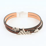 Bracelet with mountain-shaped charms on a white background
