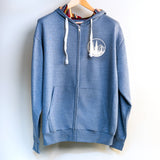 Blue hoodie with a logo on a hanger against a white background