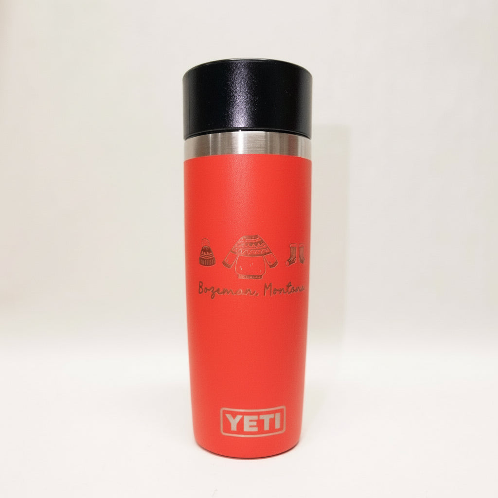 Red YETI mug with black lid on a white background