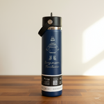 Blue insulated bottle with black lid on a wooden surface