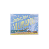 A postcard featuring a whimsical Yellowstone National Park illustration with the text 'Greetings from Yellowstone National Park' in large gold lettering against a light blue sky with clouds, stars, and two bison in a grassy landscape.