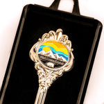 Decorative spoon with Yellowstone logo on a black background