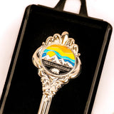 Decorative spoon with Yellowstone logo on a black background