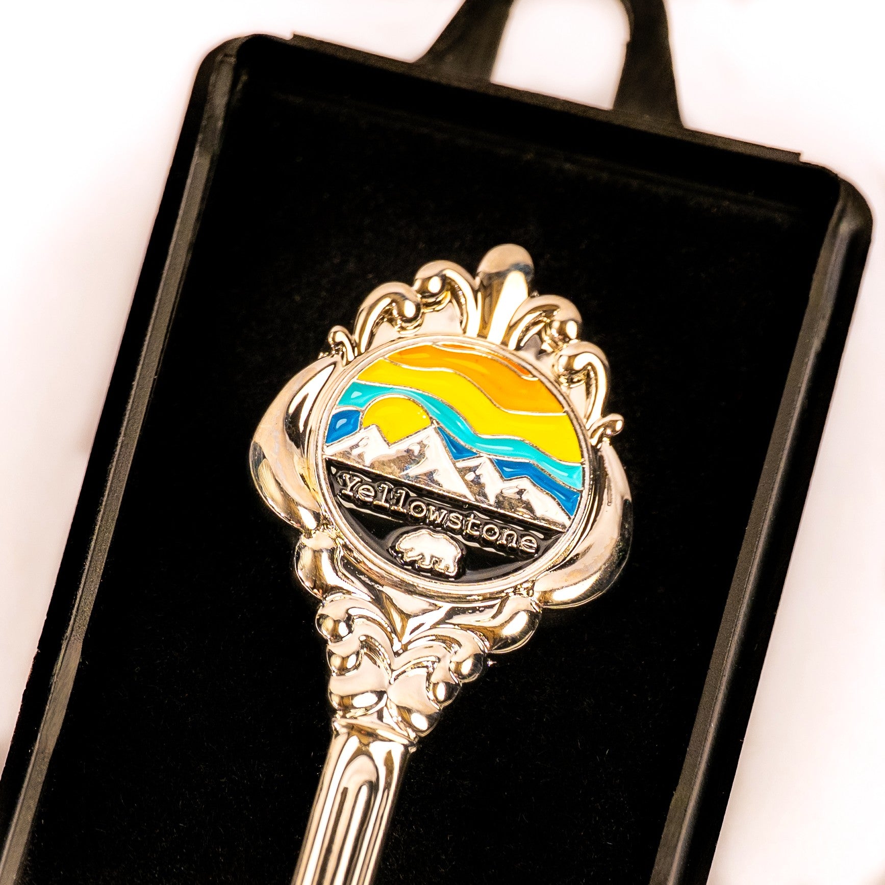 Decorative spoon with Yellowstone logo on a black background
