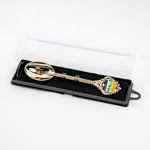 Decorative spoon in a black box on a white background
