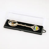 Decorative spoon in a black box on a white background