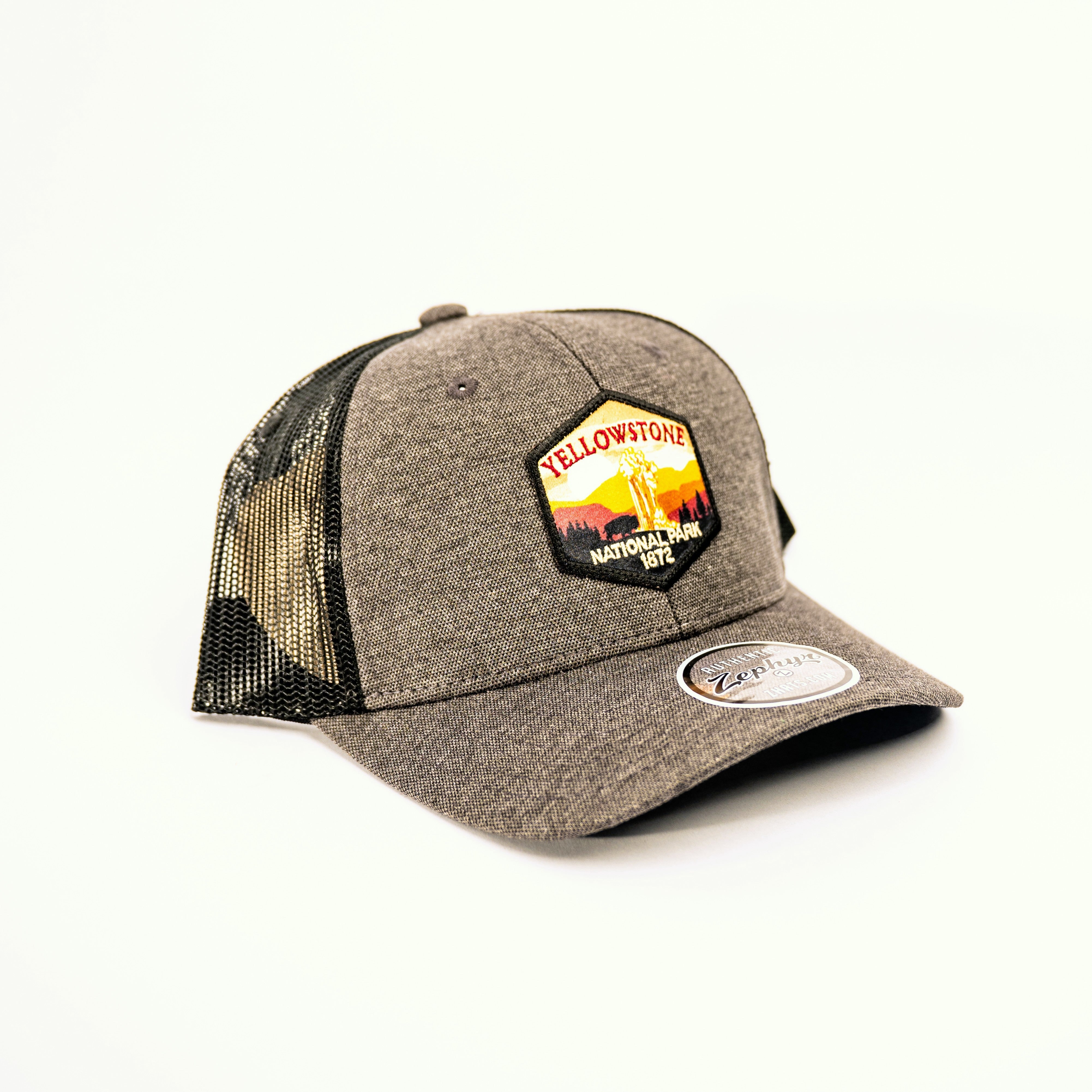 Gray trucker cap with Yellowstone National Park patch on a white background