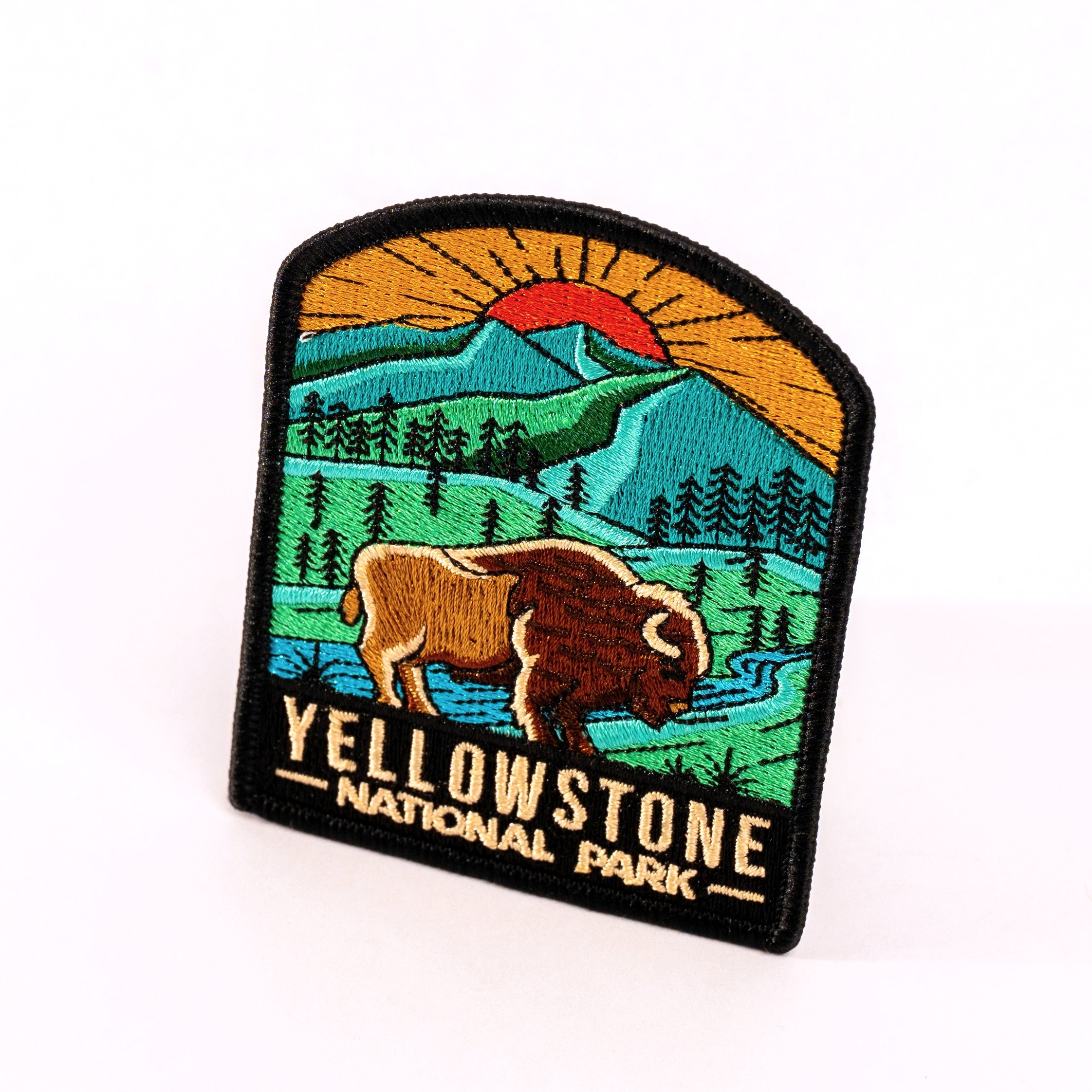 Yellowstone National Park patch with a bison and mountain landscape on a white background