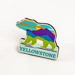 Colorful bear-shaped Yellowstone magnet on a white background