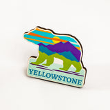 Colorful bear-shaped Yellowstone magnet on a white background