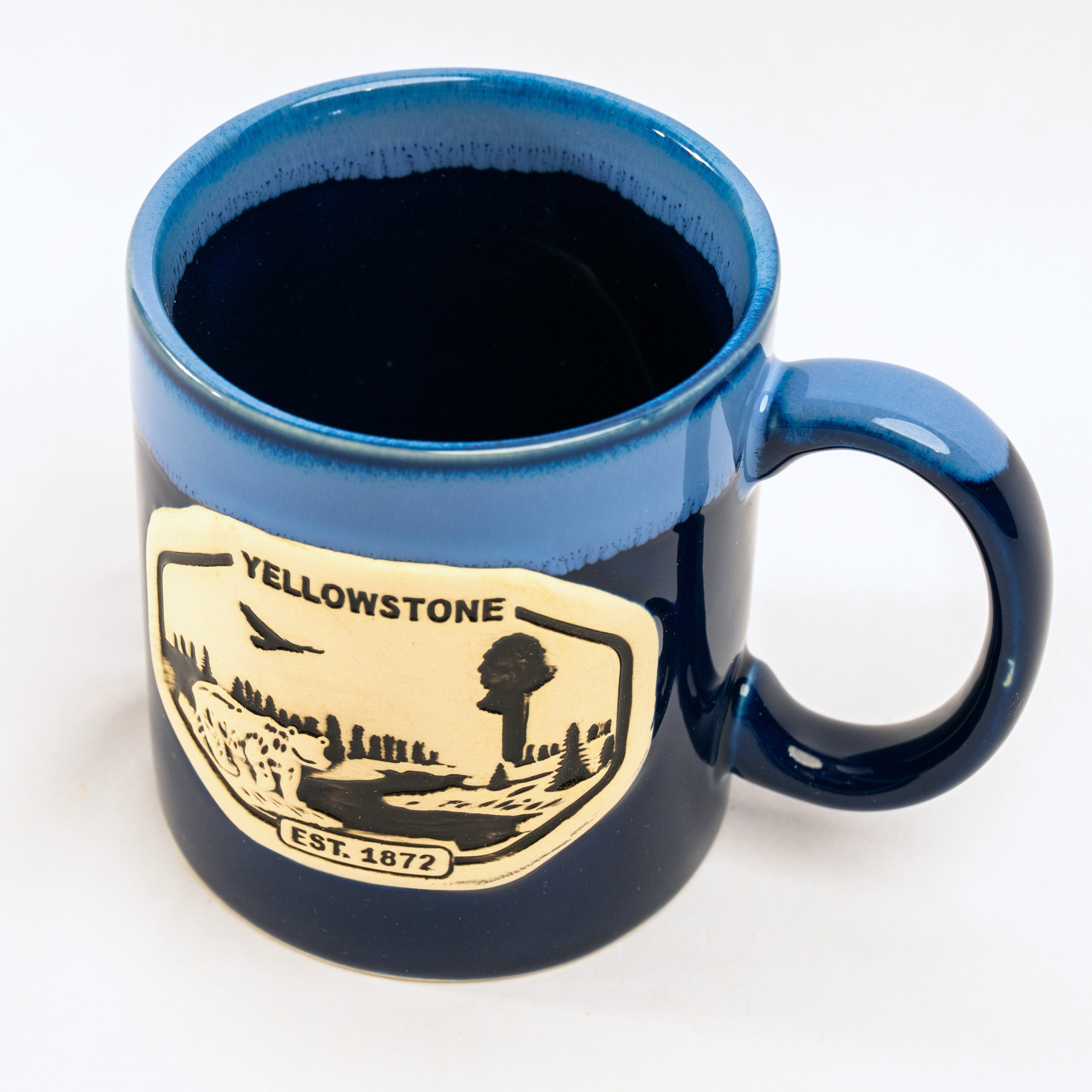 Blue mug with Yellowstone logo on a white background