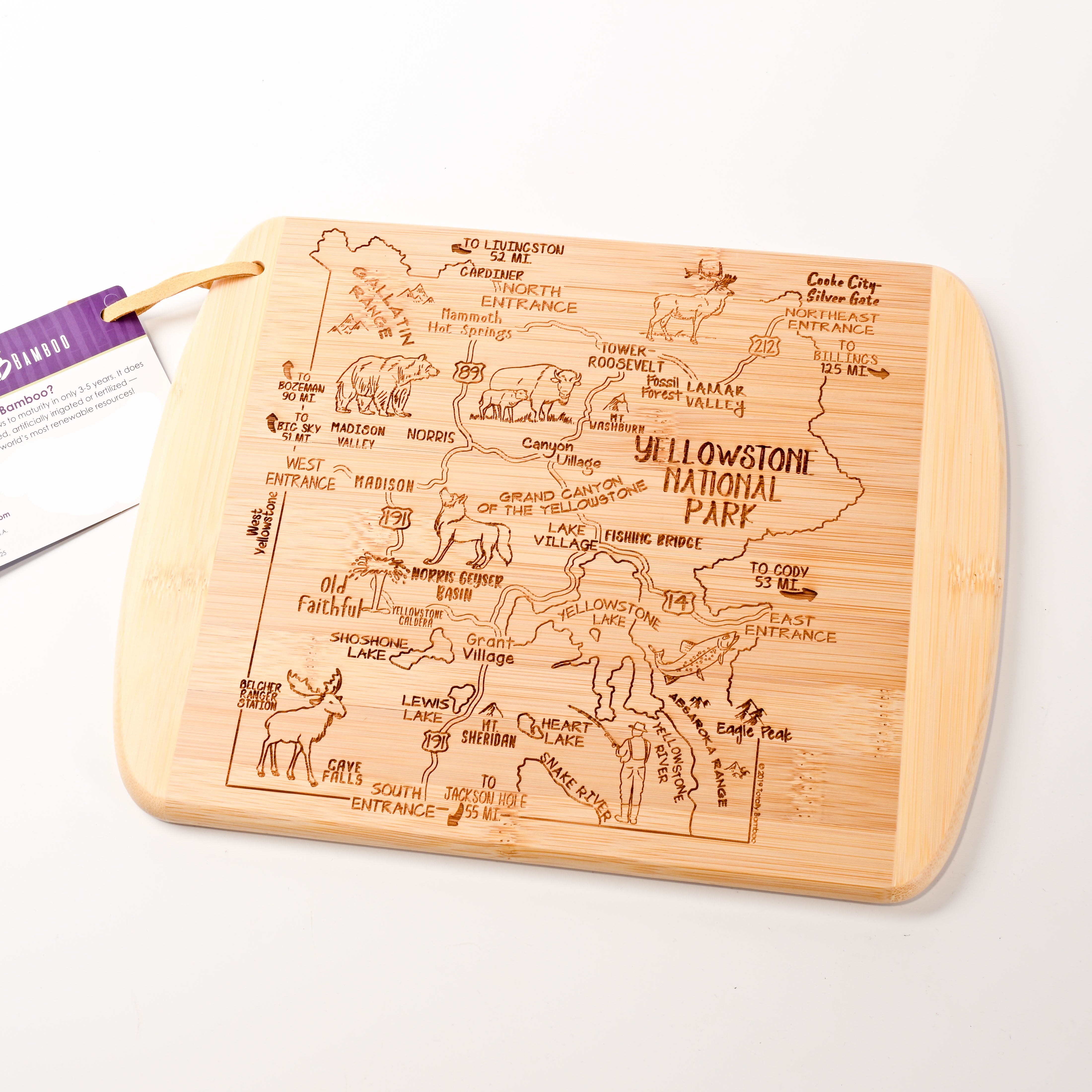 Wooden cutting board with engraved map of Yellowstone National Park on a white background