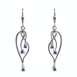 Sterling Silver earrings with Yogo sapphire blue gemstones on a white card