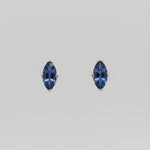 Pair of Yogo sapphire earrings on a white background