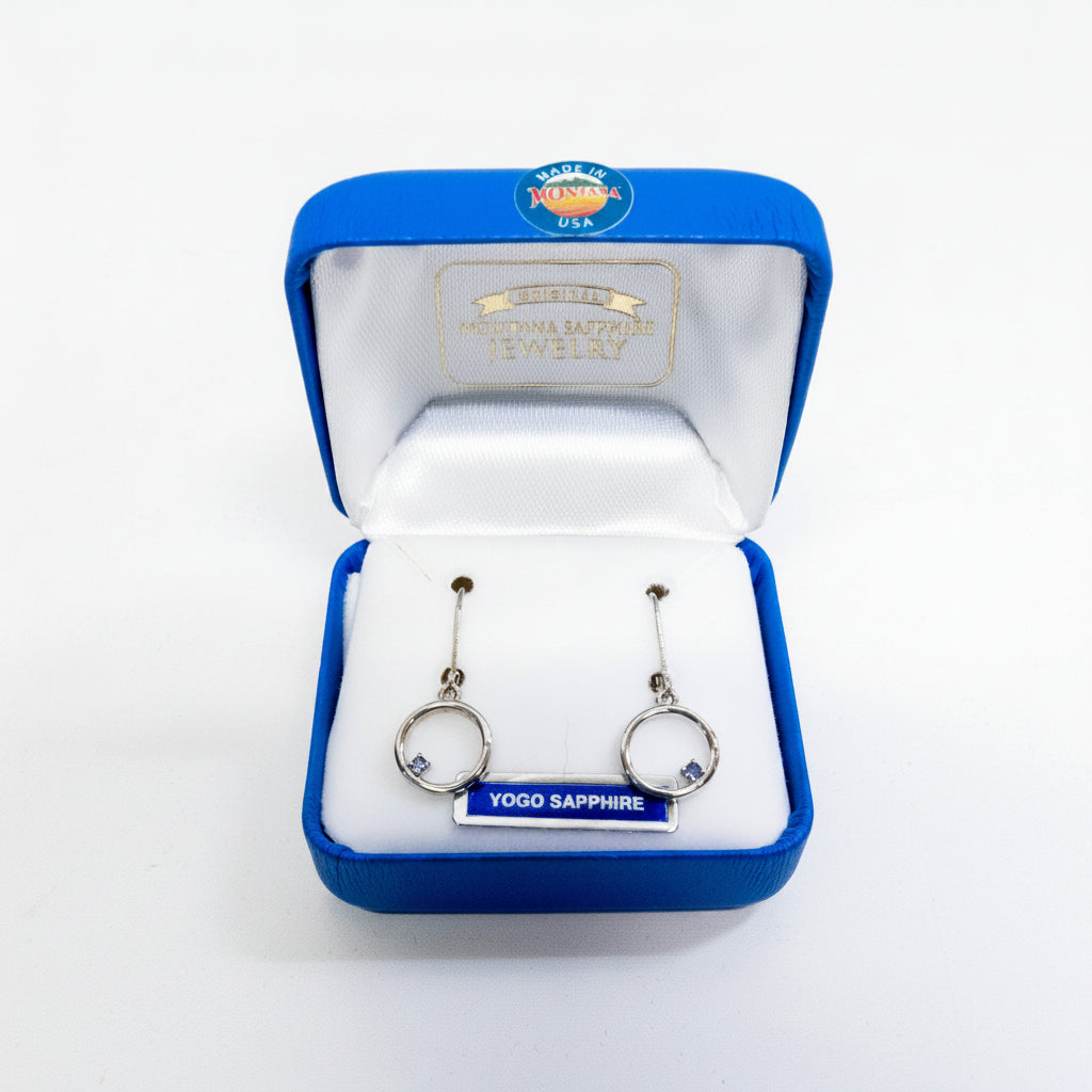 Yogo Sapphire earrings in a blue jewelry box with 'Made in Montana' label.