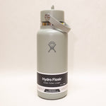 Hydro Flask water bottle with gray cap on a white background